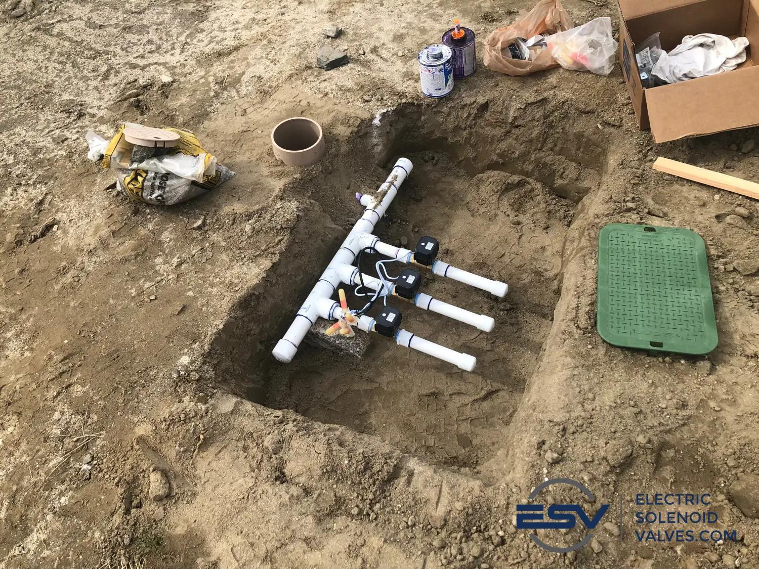 Series of 1 inch brass electric ball valves installed in an irrigation system